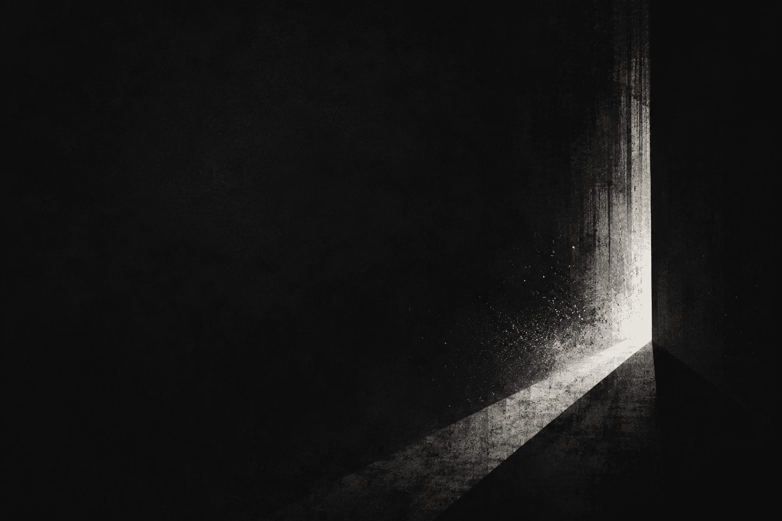 A dark concrete corner with light spilling through a vertical gap. A way out.