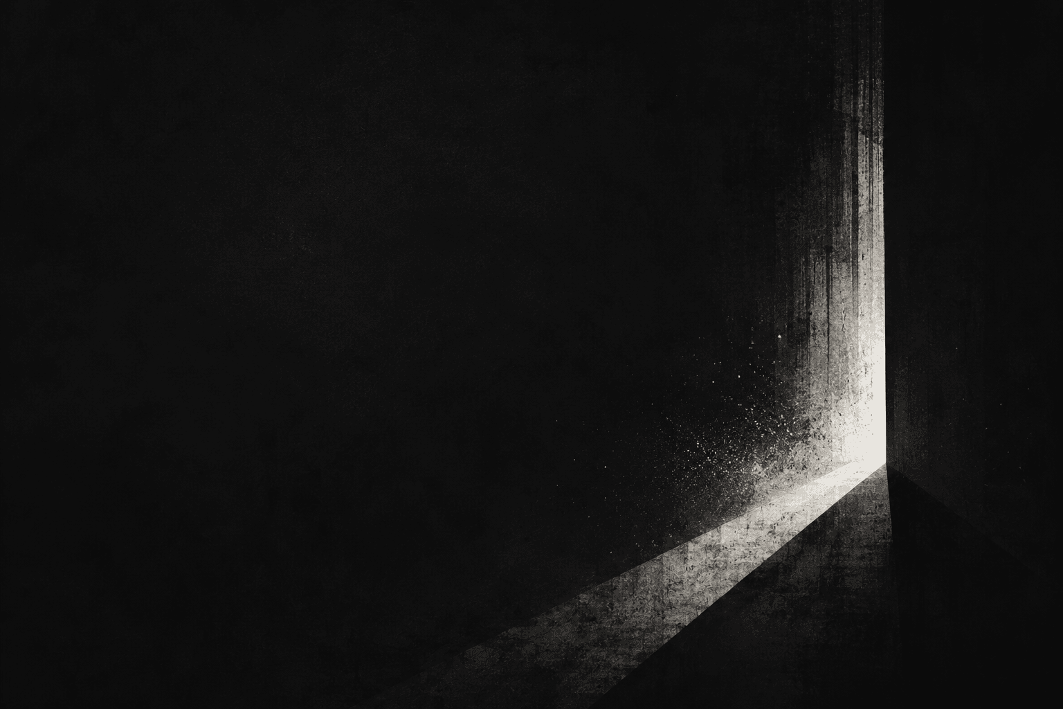 A dark concrete corner with light spilling through a vertical gap. A way out.